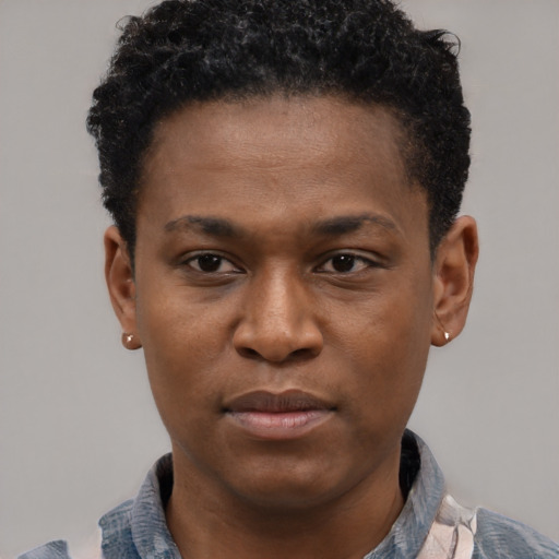 Joyful latino young-adult male with short  brown hair and brown eyes