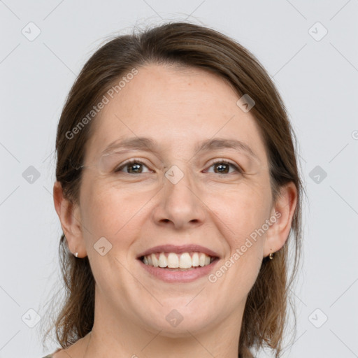 Joyful white adult female with medium  brown hair and grey eyes