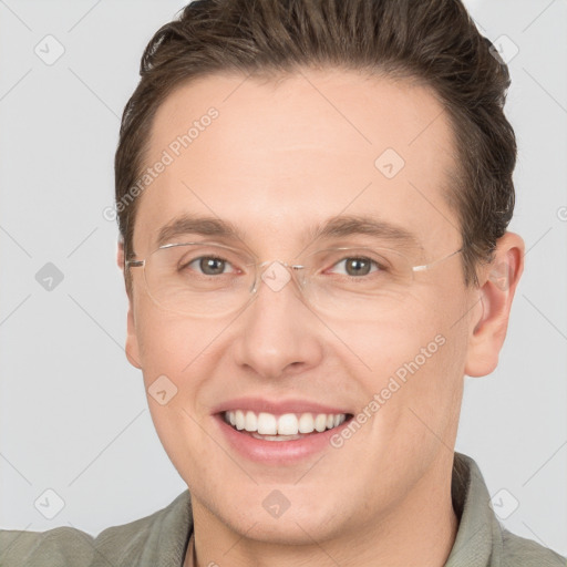 Joyful white adult male with short  brown hair and brown eyes