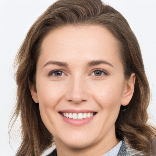 Joyful white young-adult female with long  brown hair and grey eyes