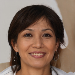 Joyful white adult female with medium  brown hair and brown eyes