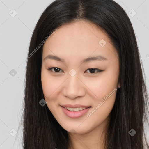 Joyful asian young-adult female with long  brown hair and brown eyes