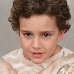 Joyful white child male with short  brown hair and brown eyes