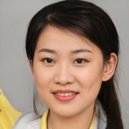 Joyful asian young-adult female with medium  brown hair and brown eyes