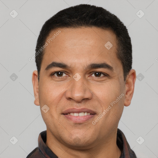 Joyful latino adult male with short  brown hair and brown eyes