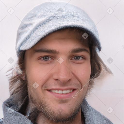 Joyful white young-adult male with short  brown hair and blue eyes