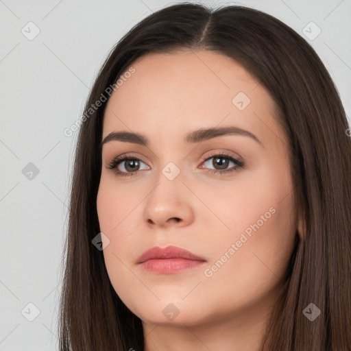 Neutral white young-adult female with long  brown hair and brown eyes