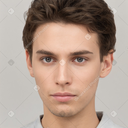 Neutral white young-adult male with short  brown hair and grey eyes