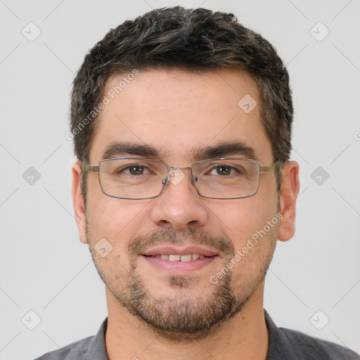 Joyful white adult male with short  brown hair and brown eyes