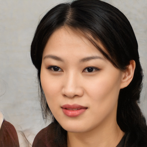 Neutral asian young-adult female with medium  brown hair and brown eyes