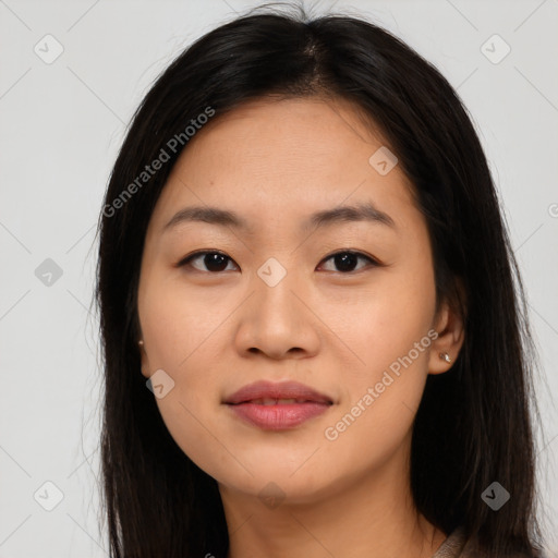 Joyful asian young-adult female with long  brown hair and brown eyes