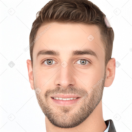 Joyful white young-adult male with short  brown hair and grey eyes