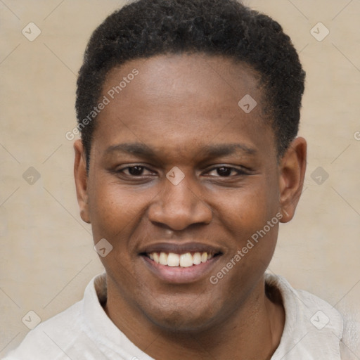 Joyful black young-adult male with short  brown hair and brown eyes