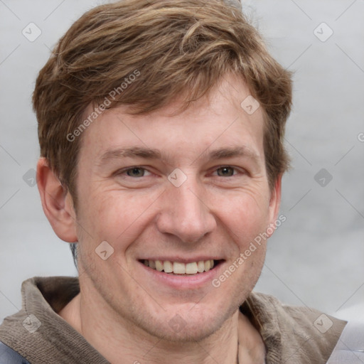 Joyful white adult male with short  brown hair and grey eyes