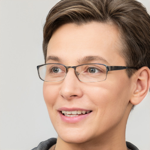 Joyful white adult female with short  brown hair and grey eyes