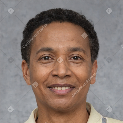 Joyful latino adult male with short  brown hair and brown eyes