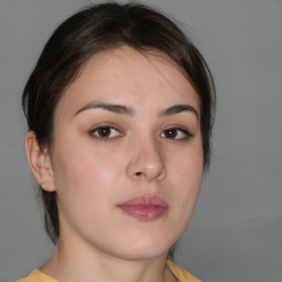 Neutral white young-adult female with medium  brown hair and brown eyes