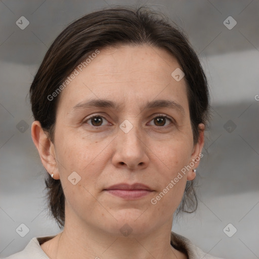 Joyful white adult female with medium  brown hair and brown eyes