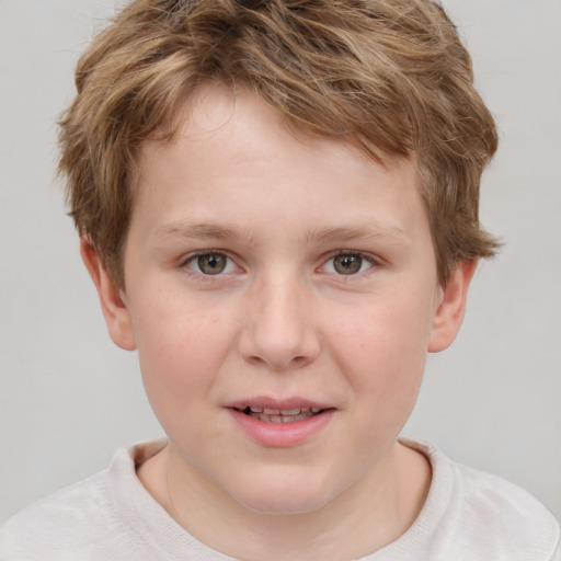 Joyful white child male with short  brown hair and grey eyes