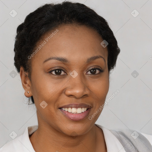 Joyful black young-adult female with short  brown hair and brown eyes