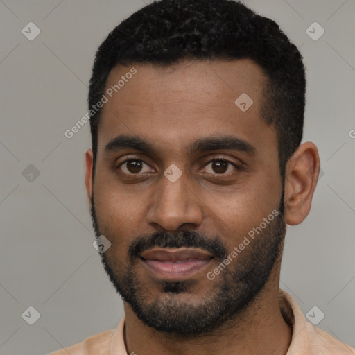 Joyful black young-adult male with short  black hair and brown eyes