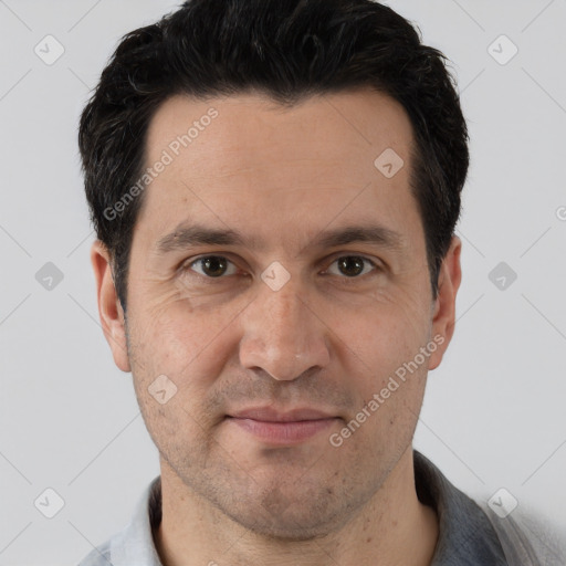 Joyful white adult male with short  brown hair and brown eyes