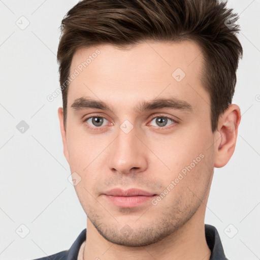 Neutral white young-adult male with short  brown hair and brown eyes