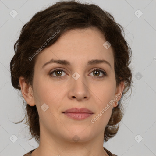 Joyful white young-adult female with medium  brown hair and green eyes