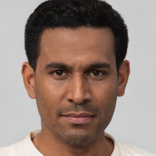 Neutral latino adult male with short  black hair and brown eyes