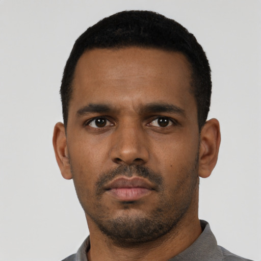 Neutral black young-adult male with short  black hair and brown eyes