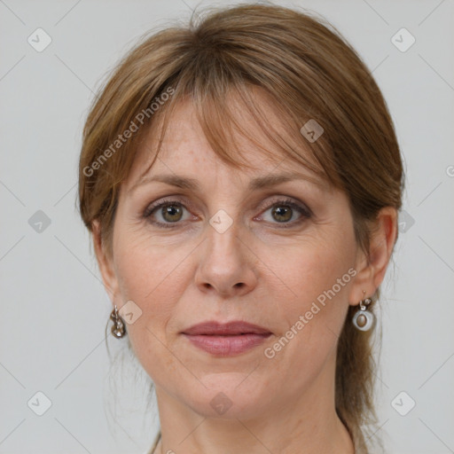 Joyful white adult female with medium  brown hair and grey eyes