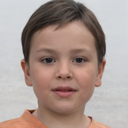 Joyful white child female with short  brown hair and brown eyes