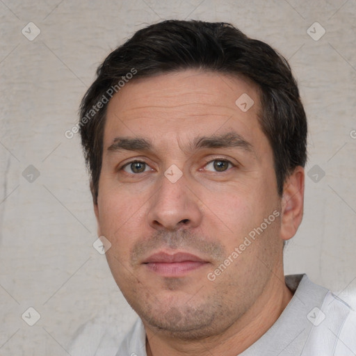 Neutral white adult male with short  black hair and brown eyes