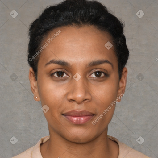 Joyful black young-adult female with short  black hair and brown eyes