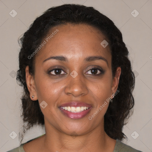 Joyful black young-adult female with medium  brown hair and brown eyes