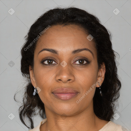 Joyful black adult female with medium  brown hair and brown eyes