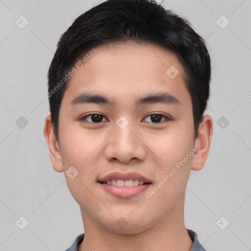 Joyful asian young-adult male with short  black hair and brown eyes