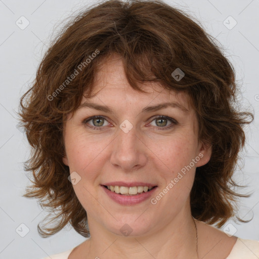 Joyful white young-adult female with medium  brown hair and green eyes