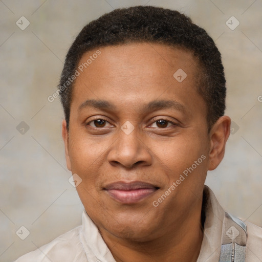 Joyful black young-adult male with short  brown hair and brown eyes