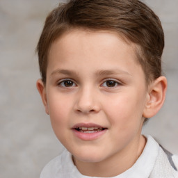 Joyful white child male with short  brown hair and brown eyes