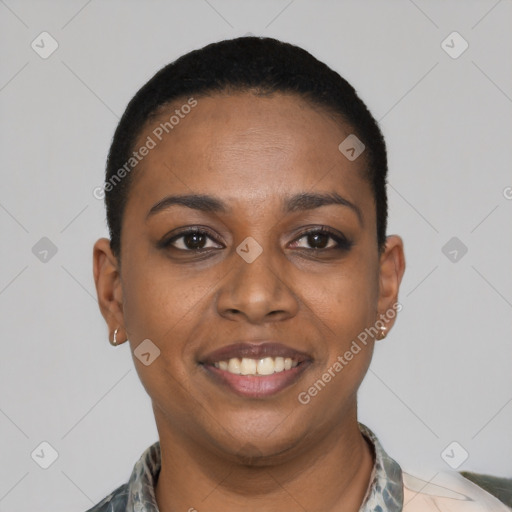 Joyful black young-adult female with short  black hair and brown eyes