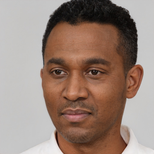 Neutral black adult male with short  black hair and brown eyes