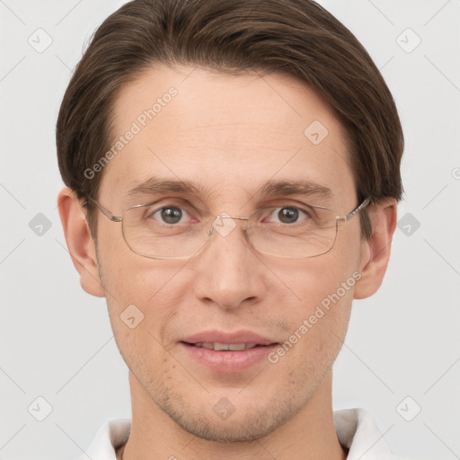 Joyful white adult male with short  brown hair and grey eyes