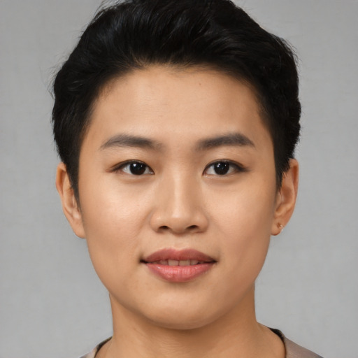 Joyful asian young-adult female with short  black hair and brown eyes