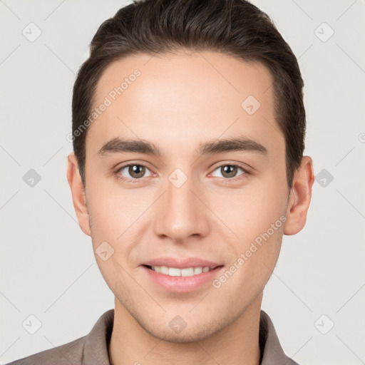 Joyful white young-adult male with short  brown hair and brown eyes