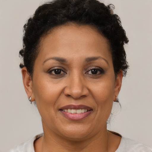 Joyful latino adult female with short  brown hair and brown eyes