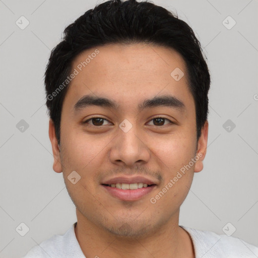 Joyful latino young-adult male with short  black hair and brown eyes