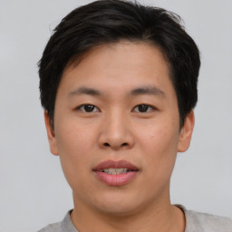 Neutral asian young-adult male with short  brown hair and brown eyes