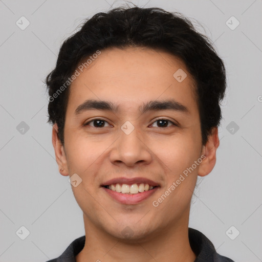 Joyful latino young-adult male with short  black hair and brown eyes