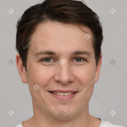 Joyful white young-adult male with short  brown hair and brown eyes